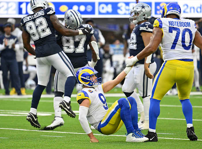 Los Angeles Rams quarterback Matthew Stafford (9) taking a hit from the Dallas Cowboys' Defense.